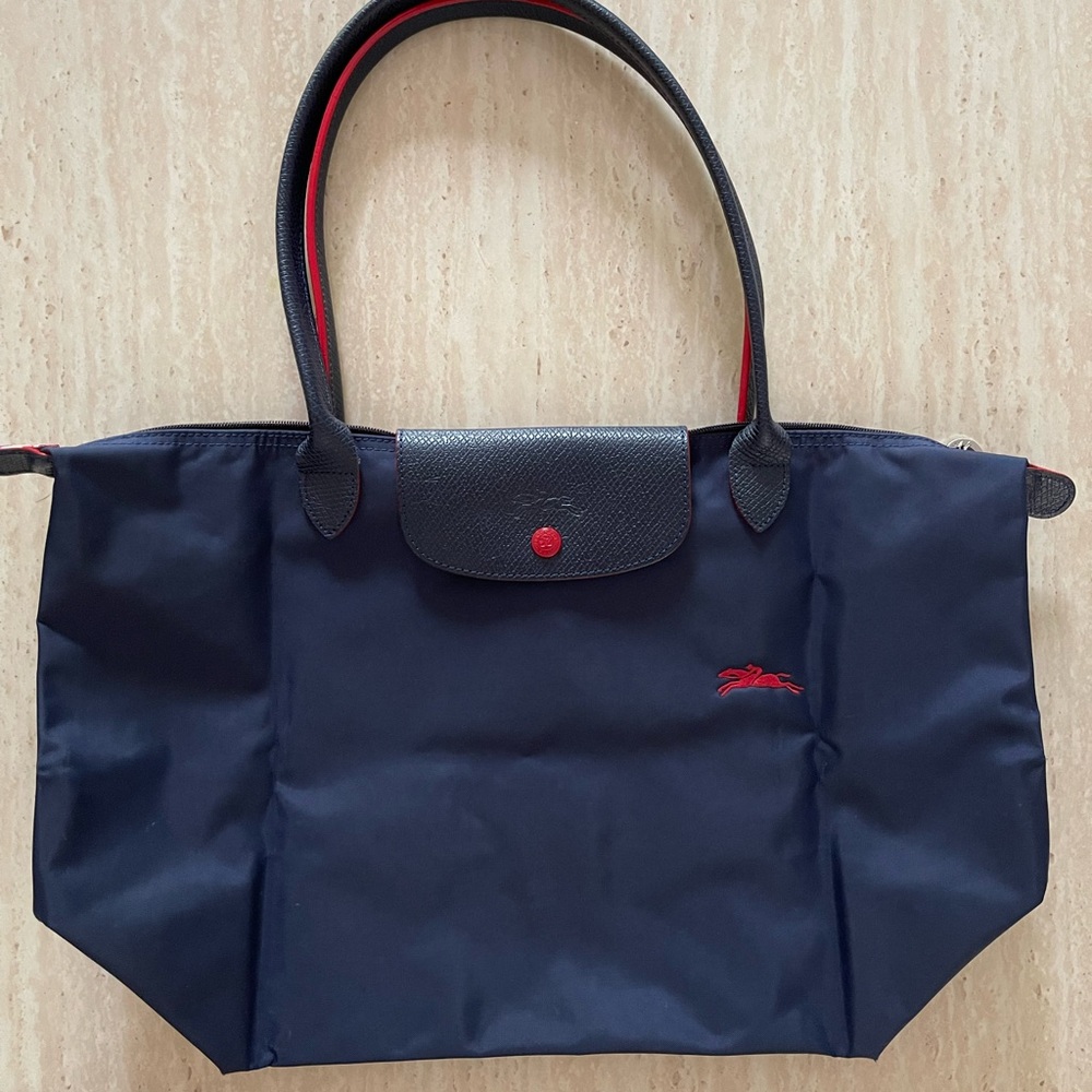 Longchamp red and blue pliage bag. Purchased from Bloomingdales.